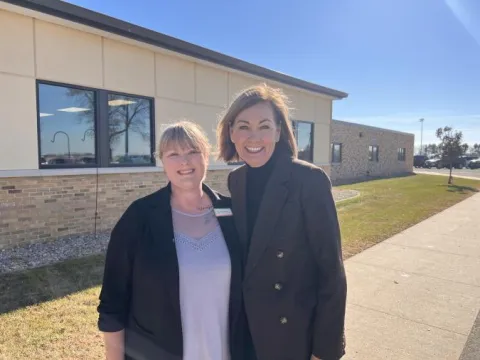 Mauree Haage and Governor Kim Reynolds.